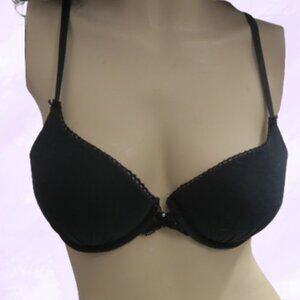 Victoria's Secret push-up demi bra frills around perimeter in black size 34C.